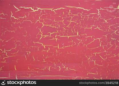 red cracked paint on yellow background