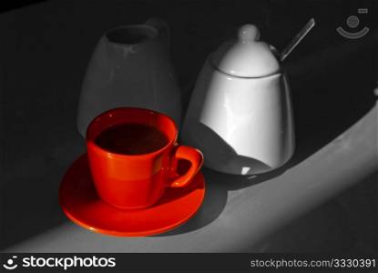 Red Cup of Coffee on Dark Grayscale Background