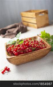 red currant, fresh currant in wooden bowl