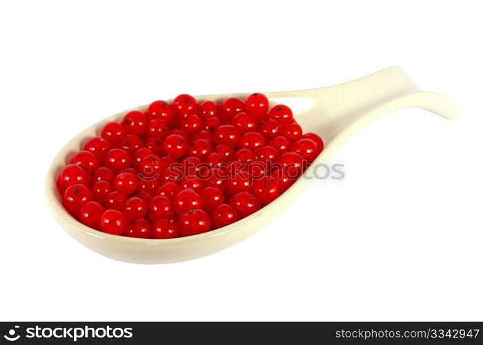 Red currants in a scoop isolated on white
