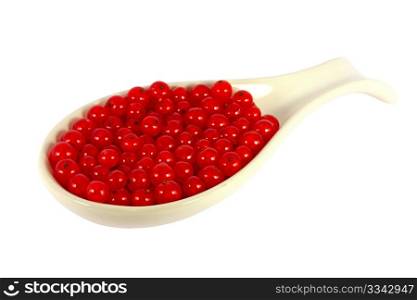 Red currants in a scoop isolated on white