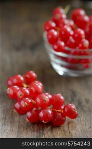 Red currants isolated on old wood