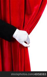 Red curtain. Close up of hand in white glove open the curtain. Place for text