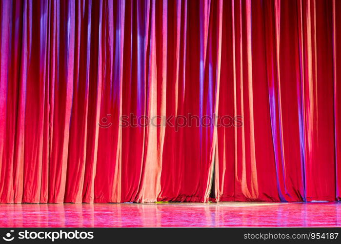 Red curtains and the spotlight in the Theater between shows.