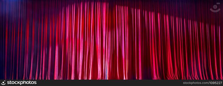 Red curtains panorama closed and the lights to a scene.