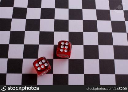 Red Dice on a checked background