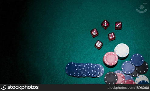 red dices casino chips green poker table. Resolution and high quality beautiful photo. red dices casino chips green poker table. High quality beautiful photo concept