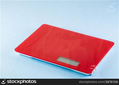 Red Digital Electronic Kitchen Scale isolated on blue background