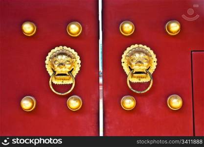 Red door in hutong area, close to Forbidden City, Beijing, China