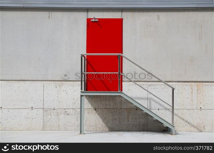red door on the wall in the building