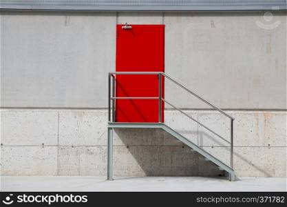 red door on the wall in the building