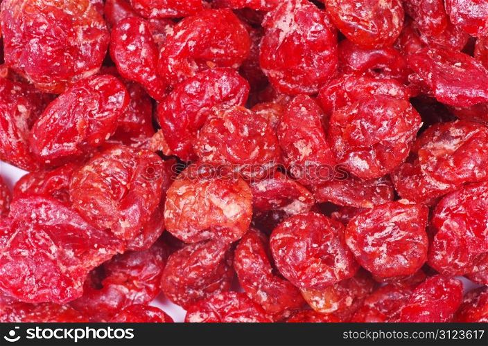 red dried goji berries on white