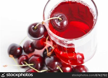 Red drink and ripe cherry berries