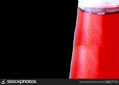 Red drink in the bootle. Black background