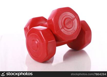Red dumbbells isolated over white.
