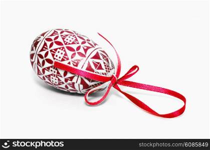 red easter egg with bow on white background