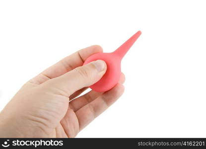 Red enema in hand isolated on white