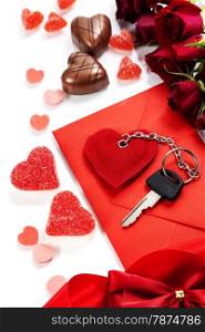 Red envelop, roses, chocolate and key On white background