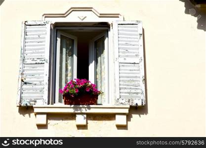 red europe italy lombardy in the milano old window closed brick abstract grate flower