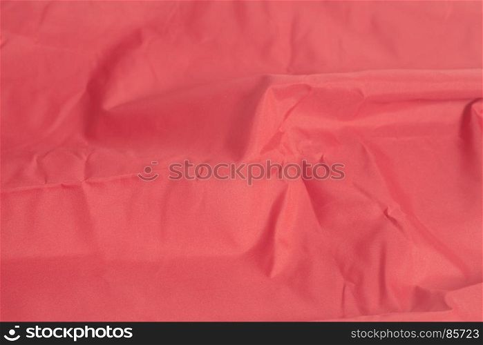 Red fabric background closeup