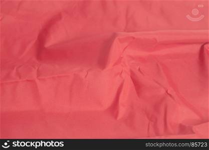 Red fabric background closeup