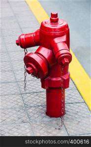 red fire hydrant on a city street