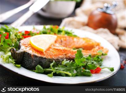 red fish on plate and on a table