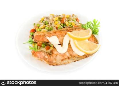 Red fish rice and vegetable dish isolated on white