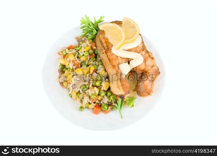 Red fish rice and vegetable dish isolated on white