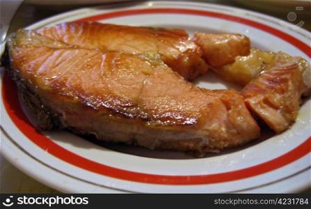 Red fish steak on the plate