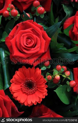 Red flower arrangement with roses and gerberas