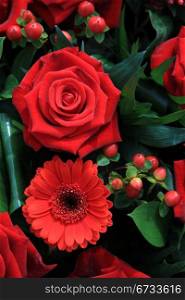 Red flower arrangement with roses and gerberas