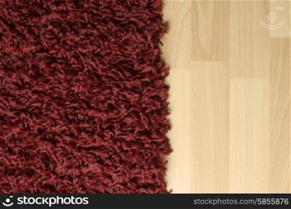 Red fluffy rug on laminate floor
