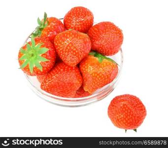 Red fresh strawberries with green leafs in transparent plate. Isolated on white backdrop. Close-up. Studio photography.