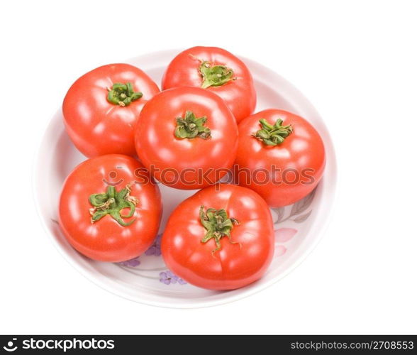 Red fresh tomatoes in dish, isolated on white background