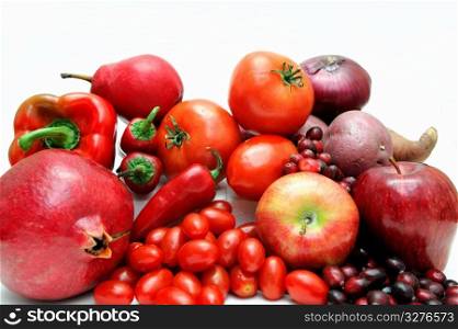Red Fruit And Vegetables. Various fruits and vegetables all with red coloring including bell pepper, hot chilies large and small tomatoes apples and cranberries