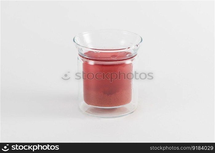 red fruit drink in glass with mint and lemon. fresh beverage in a glass