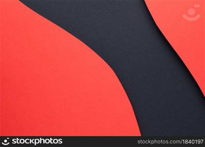 Red geometric shaded paper layers on black paper background. Copy space. Top view. Flat lay. Geometric Shaded Paper Layers On Black Background