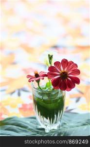 Red Gerbera or Barberton daisy flowers in clear glass decorate on table. Chrysanthemum blooming flower.