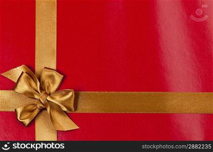 Red gift background with gold ribbon