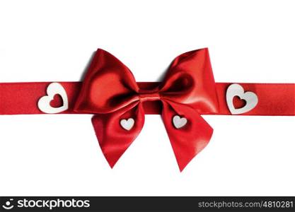 Red gift bow and hearts. Red gift bow and hearts isolated on white background