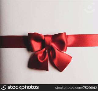 Red gift bow on white background holiday gift concept. Red gift bow on white