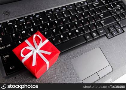red gift box on a laptop keyboard