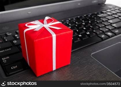 red gift box on a laptop keyboard