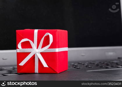 red gift box on a laptop keyboard