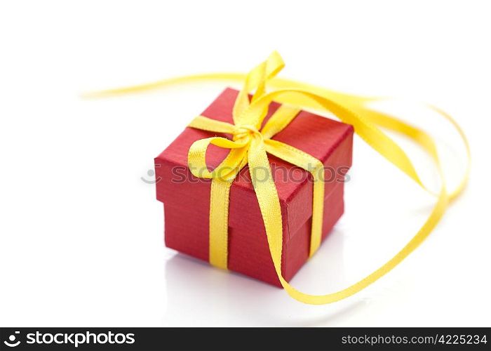 red gift box with a yellow ribbon isolated on white