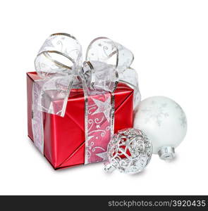 Red gift box with Christmas balls on white background