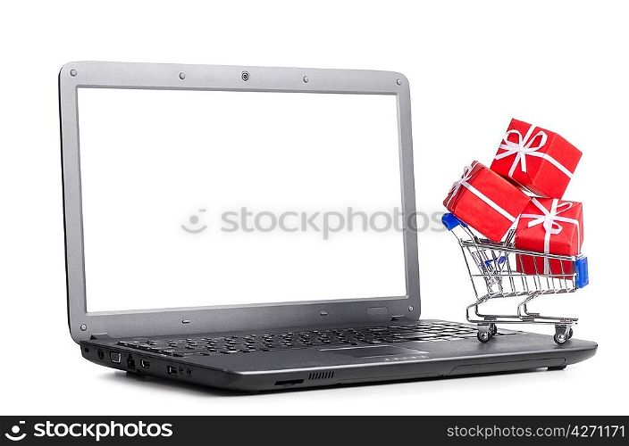 red gift boxes in shopping cart on a laptop, cut out from white