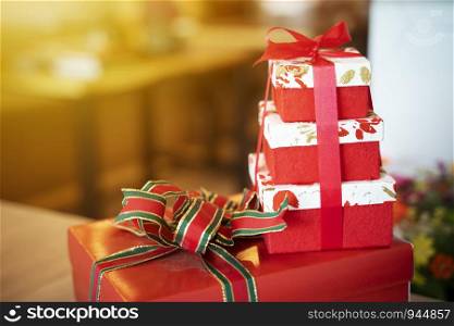 Red gift boxes with blurred background. Holiday and celebration backdrop.