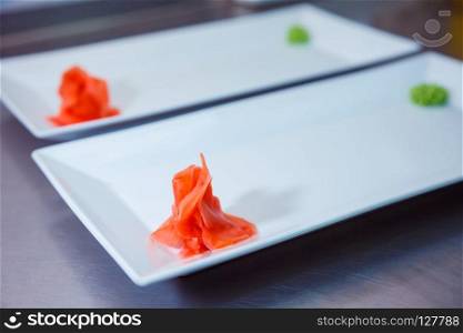 red ginger on white plate. food